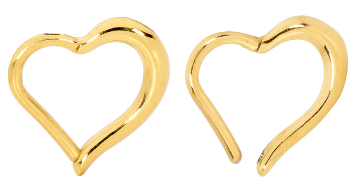 1 par de aros con segmentos de bisagra de acero inoxidable de 16 g con forma de corazón.